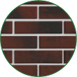 Круглое изображение с крупным планом кирпичной стены из красного кирпича с белыми швами. Поверхность представляет керамическую облицовку фасада, создающую монолитный и устойчивый к погоде внешний вид.